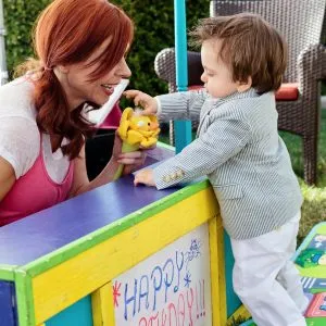 Baby Puppet Show Party with a Toddler watching a puppet show.